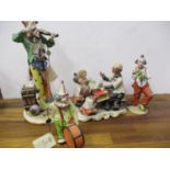A Capodimonte figural group of a choir-master and three students and other Capodimonte figures A/F