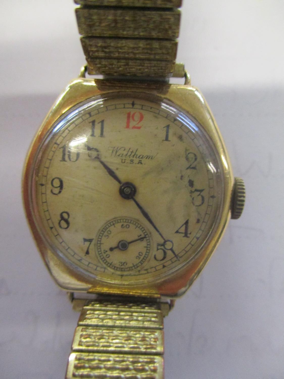 A 1930s Waltham 9ct gold cushion cased wrist watch having a cream dial with Arabic numerals, red - Image 3 of 4