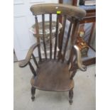 An early 20th century elm seated Windsor lath back chair