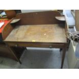 A 19th century mahogany wash stand having a raised back and tapered legs 38"h x 36"w