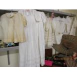 A collection of early 20th century children's clothing and later, to include christening dresses and