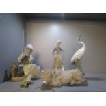 A group of Lladro figurines and model animals to include a seated woman with pots