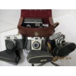A vintage Opticom editor viewer, a Halima 3000, a Kodak Coloursnap 35, a Berrette and a cine camera,