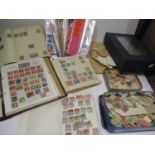Three stamp albums containing worldwide stamps including China and Czechoslovakia, a stock book to
