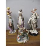 Three Guiseppe Armani Capodimonte figures of clowns and a figural group A/F