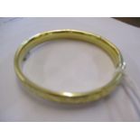 A yellow metal bangle, 13.1g