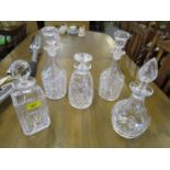 Cut and pressed glass decanters to include a pair of decanters, a Stuart crystal decanter and a