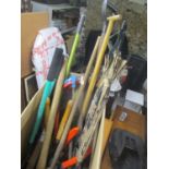 A selection of garden tools, together with an umbrella