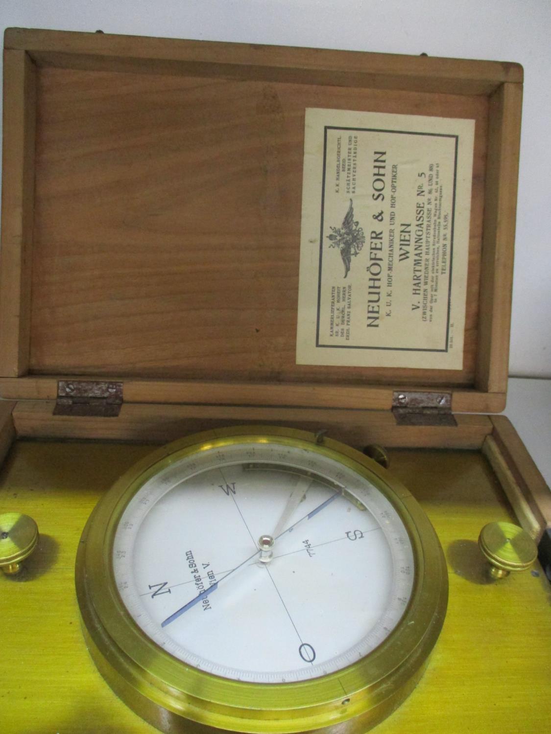 A Neuhofer & Son lacquered brass compass in a box