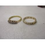 A yellow gold ring set with five diamonds, stamped 18ct and a gold full eternity ring set with white
