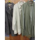 A vintage Aquascutum Aqua 5 gents steel grey rain mac, together with a cream Aquascutum rain mac and