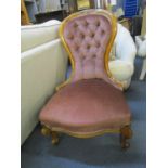 A late Victorian walnut framed spoon back chair raised on cabriole legs