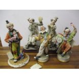 Two Guiseppe Armani Capodimonte figures of clowns and three others
