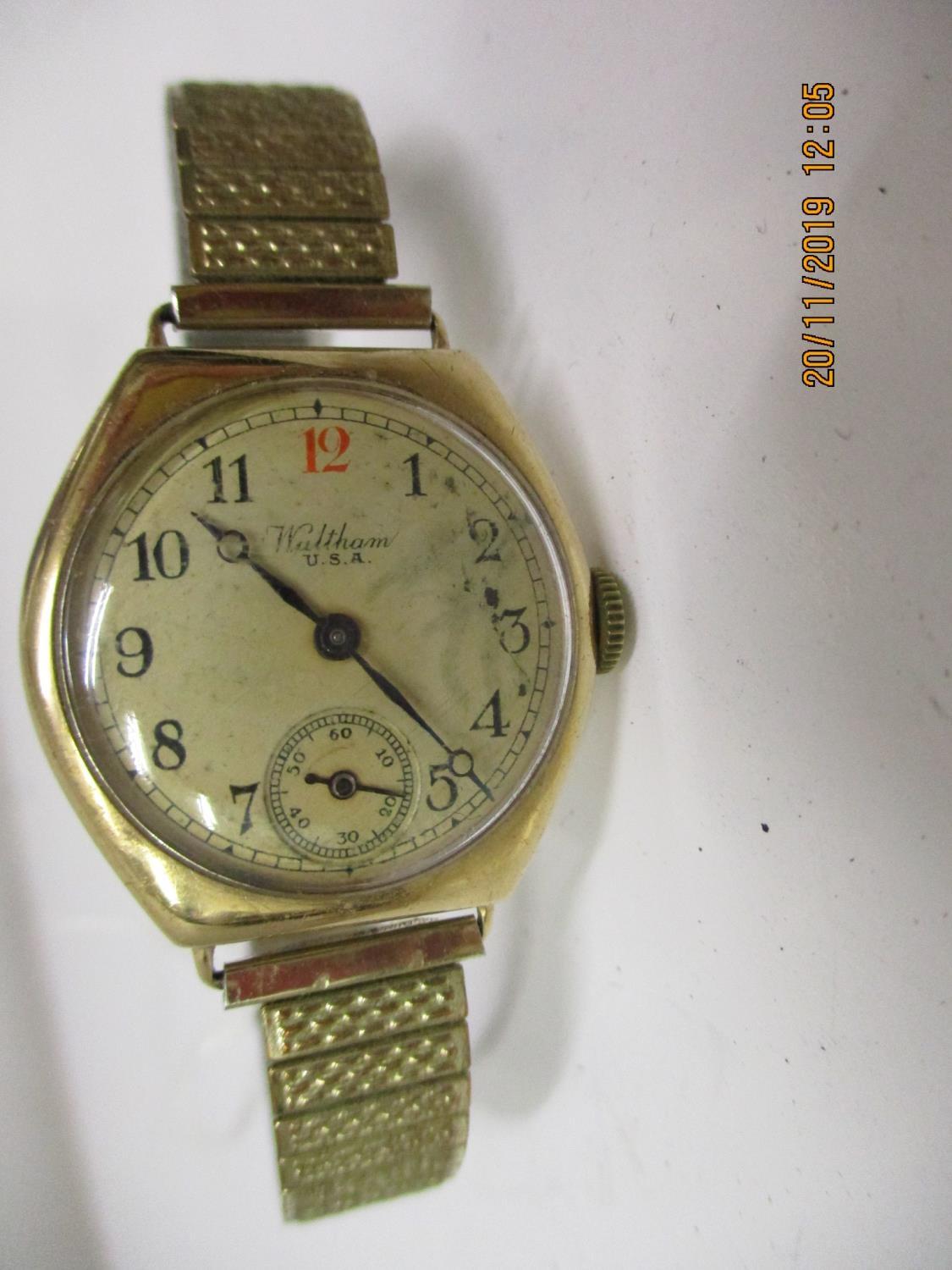 A 1930s Waltham 9ct gold cushion cased wrist watch having a cream dial with Arabic numerals, red - Image 2 of 4