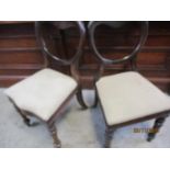 A pair of kidney backed mahogany dining chairs