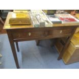 A 19th century oak side table with two frieze drawers having inset ivory escutcheons, on square legs