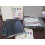 A selection of various stamp albums, containing stamps from around the world