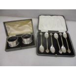 A set of six silver teaspoons case and a pair of silver napkin rings, boxed