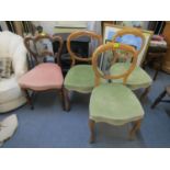 Three Victorian balloon back dining chairs with green upholstered seats and French cabriole front