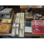 A selection of boxed cutlery, an Italian Sorrento inlaid wooden cigarette box and other items