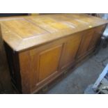 An early 20th century large oak panelled coffer having a hinged top and two drawers below 27 1/2"h x