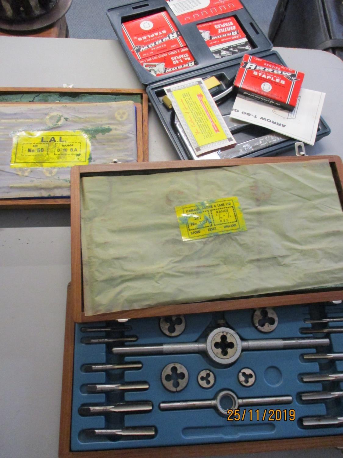 An Arrow multi purpose staple gun in a blue case, together with four boxes of staples and other