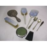 A silver and enamelled three piece dressing table set, a circular silver photo frame, A/F, a white
