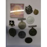 A group of medals and badges to include a WW1 BWM named to i35502 Pte FF Lavington, Royal