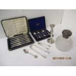 Silver to include six apostle spoons, a glass scent bottle, a candlestick A/F, two sugar tongs and