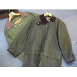 A gents green Timberland jacket size M, together with a Marks & Spencers green wax cotton jacket,