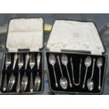 A cased set of six silver cake forks Sheffield 1925 and a cased set of seal topped coffee spoons and