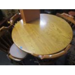 A modern pine circular kitchen table, 29" h x 41"w and four chairs