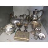 Silver plate to include a four piece teaset, a tea strainer, a cigarette box, a rose bowl and