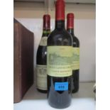 Three bottles of red wine Chateau Laffitte Carcasset Saint Estephe 2009 and a bottle of Nuils
