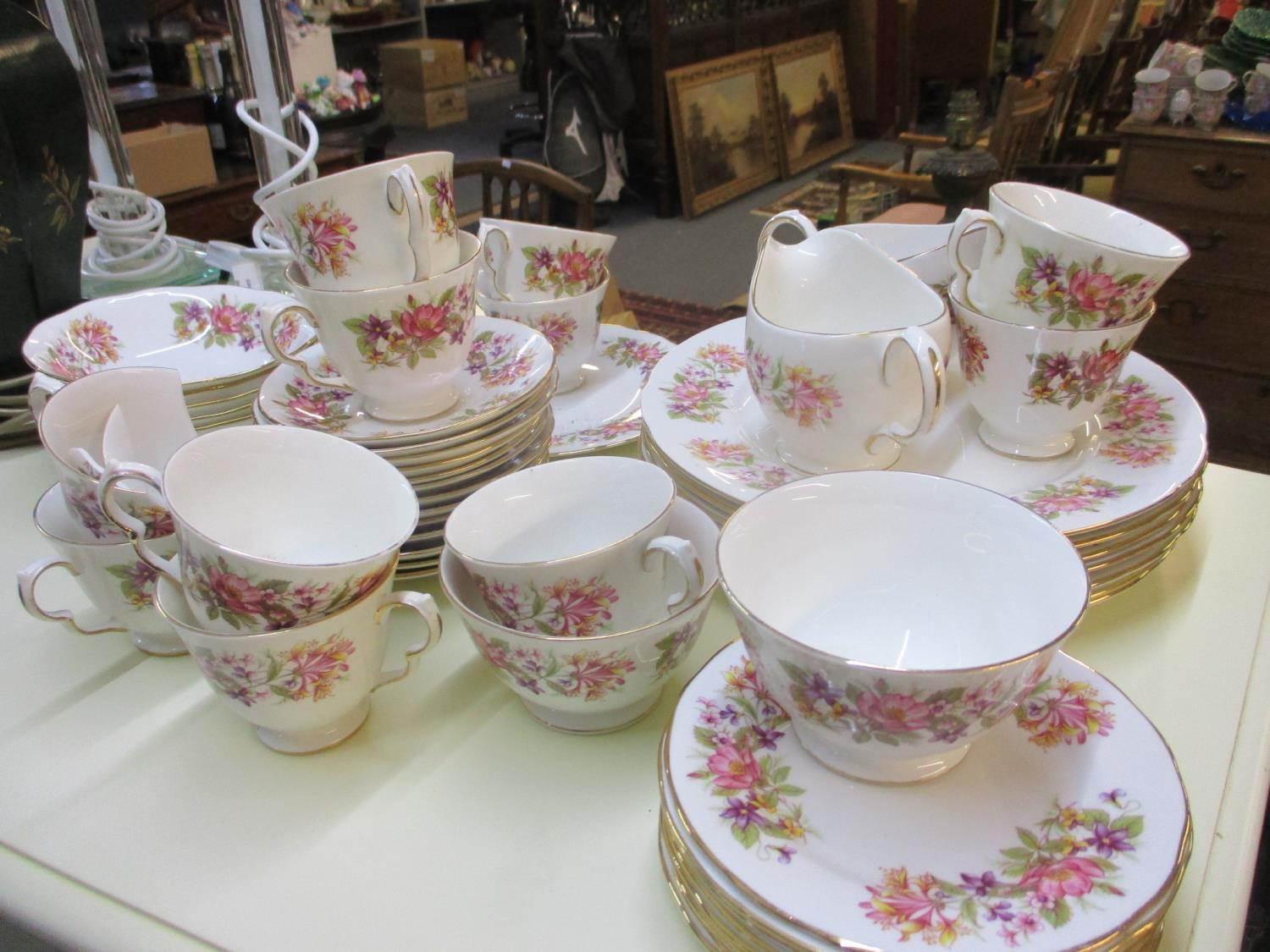 A Colclough floral bone china part dinner service and part tea set (one tea cup A/F)