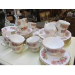 A Colclough floral bone china part dinner service and part tea set (one tea cup A/F)
