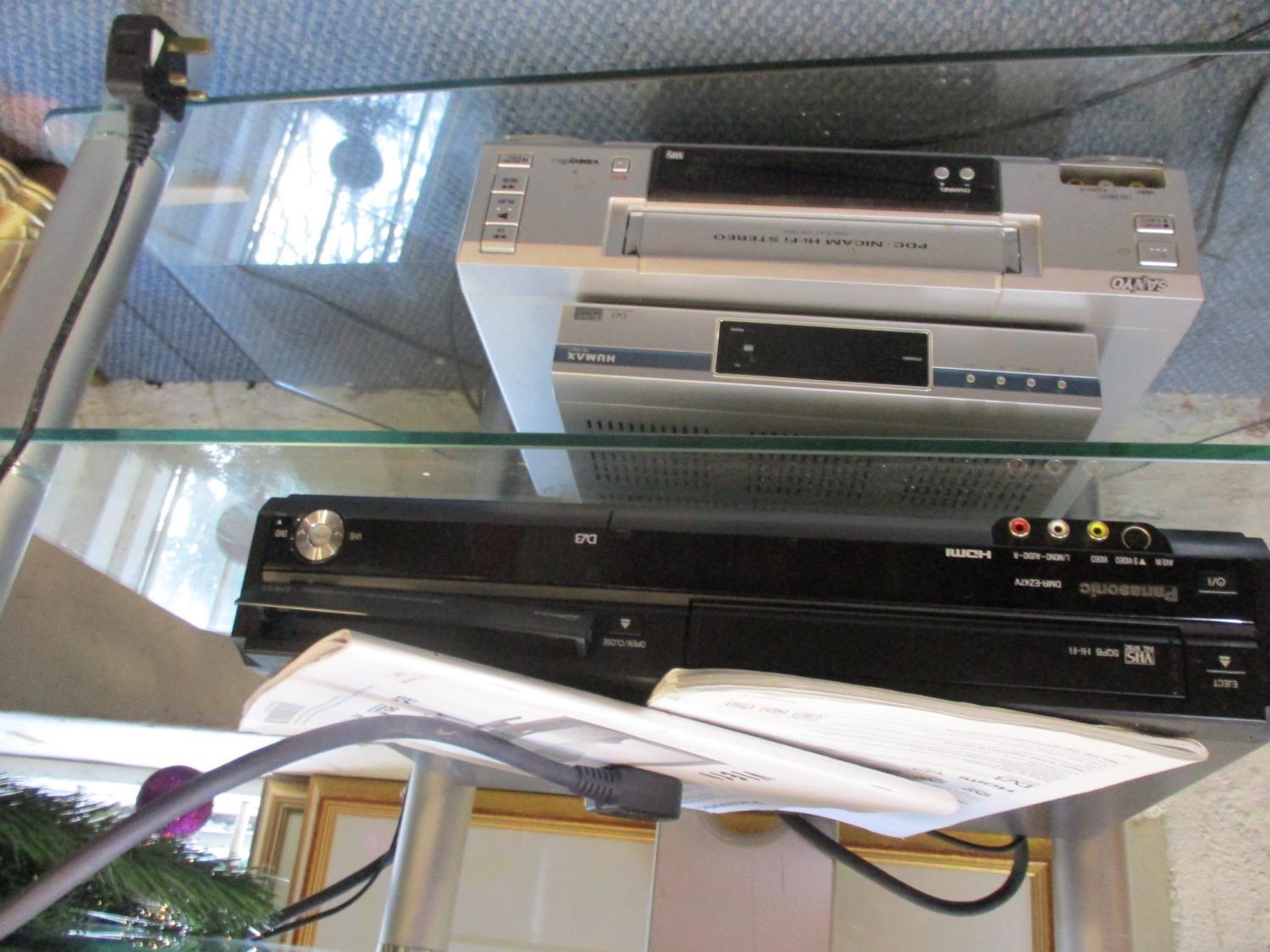 A Panasonic Viera flatscreen television, VHS cassette player and a Sanyo combination unit with - Image 2 of 2