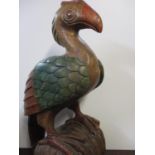 A carved wooden, floor standing model of a dodo