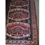 Persian wool rug, liphook decoration, barbers pole, blue ground