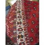 A red ground Middle Eastern rug and one other