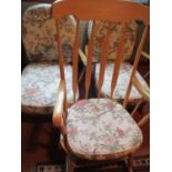 A pair of Ercol easy chairs with floral loose cushions and a beech rocking chair