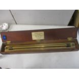 A Jame White of Glasgow brass rule in a mahogany box, 25"w