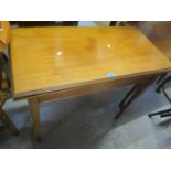 An early 20th century walnut fold over card table on tapering, square legs, 30 1/2"h x 36"w