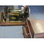 An oak cased Singer sewing machine, serial number S1736786, circa 1906