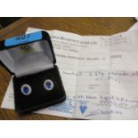A pair of blue topaz and zirconia clip on earrings set in a white gold mount, marked 750,