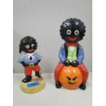 Two Carlton ware golly figurines, one golly on a space hopper, a limited edition No 76/100, the