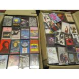 Four boxes of mixed cassette tapes