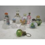 A group of nine various glass scent bottles to include four oriental snuff bottles and a cranberry