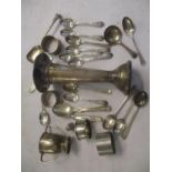 Mixed silver to include a vase, small trophy, napkin rings, spoons and other items