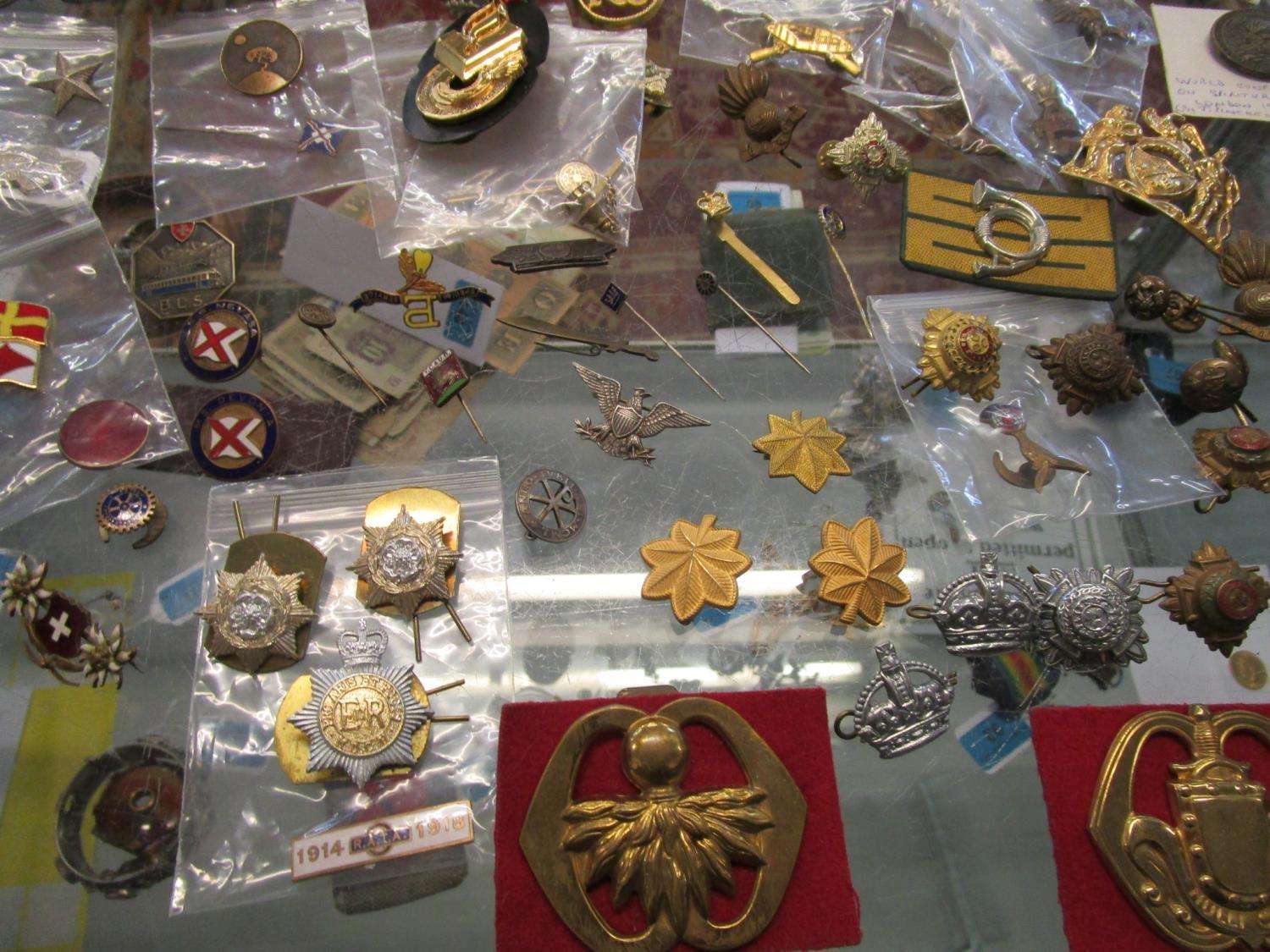 A quantity of military cap badges, school and club badges, sports badges and medals and other - Image 4 of 5